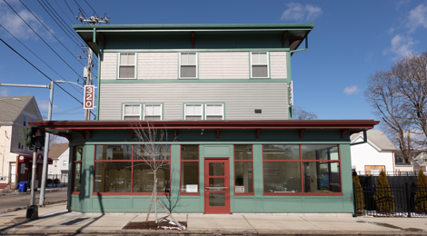 mixed-used development with ground-level windows and front door