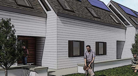 exterior of Eva Mondon Commons with landscaping and man and child standing in greenspace in front of building and man trying to open door of a unit