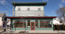 mixed-used development with ground-level windows and front door