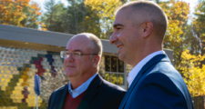 A profile photo of two male leaders of Saco & Biddeford Savings Institution standing outdoor next to each other.