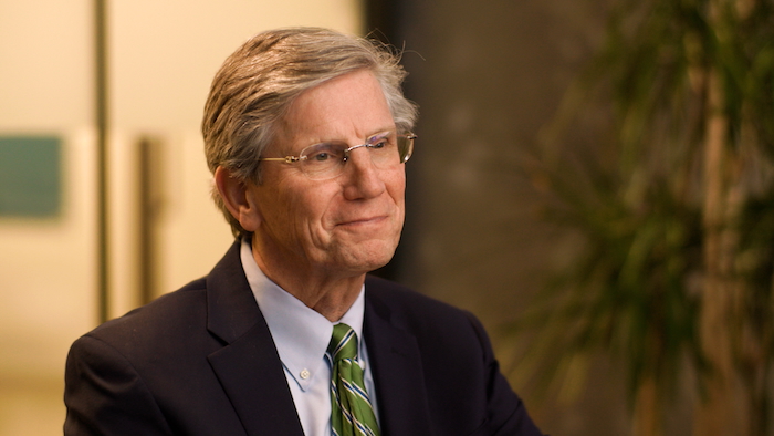 FHLBank Boston President Tim Barrett wearing a suit jacket and tie.