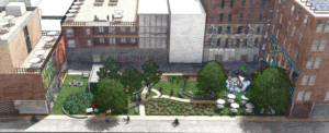 Overhead shot of a series of multi-level buildings with a greenspace with trees, walkways, a playground, and people walking in the middle