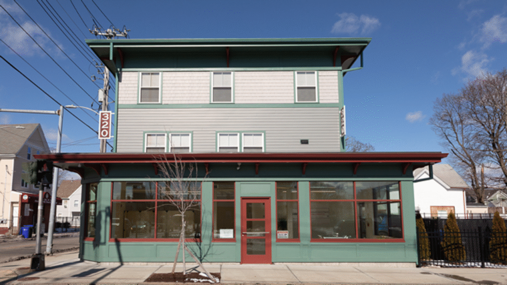 mixed-used development with ground-level windows and front door

